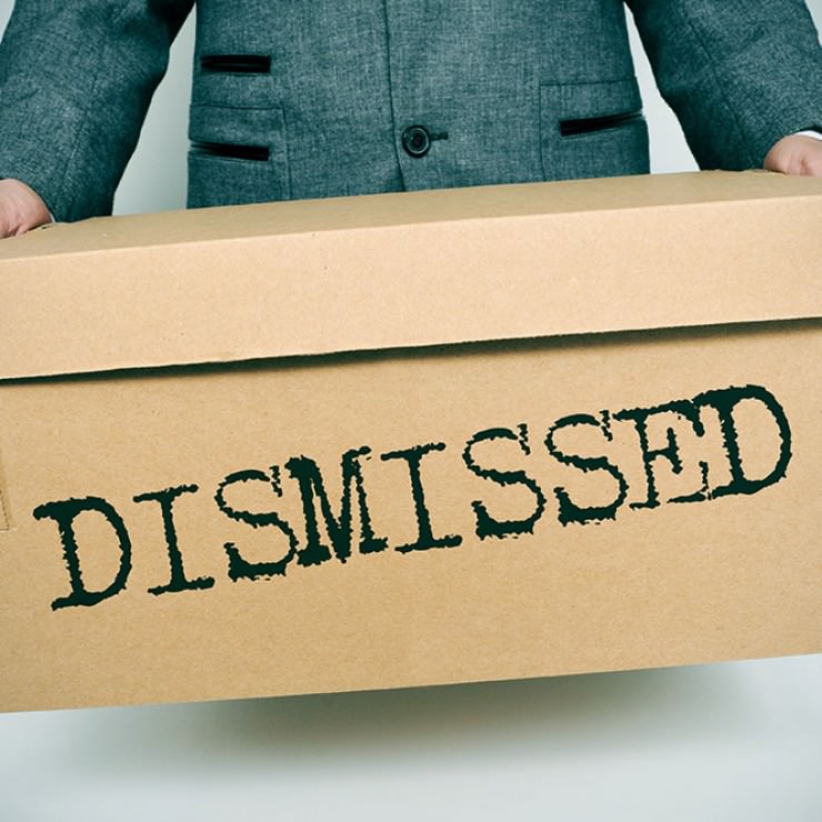 man-holding-box-saying-DISMISSED.jpg